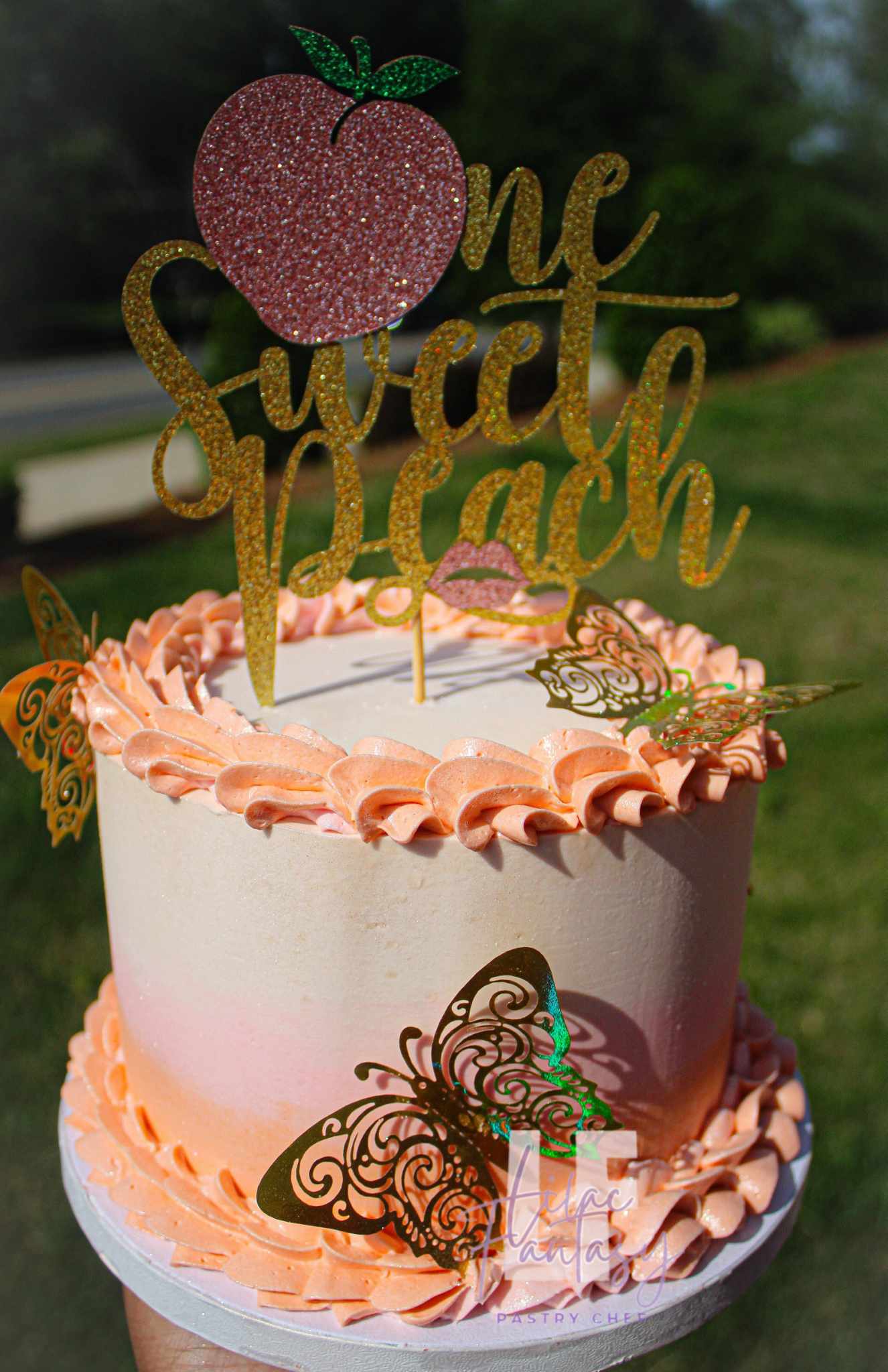 6-inch custom smash cake pink with wording of one sweet peach, baked by pastry chef Lilac