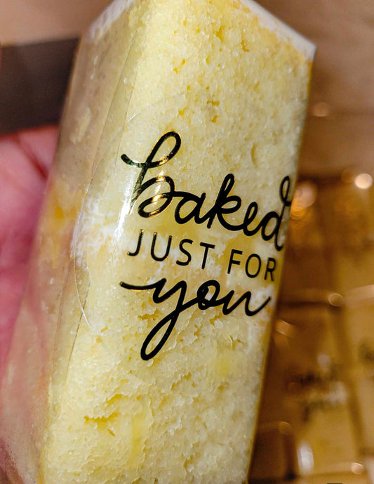 Single cake slice packaged and labeled "Baked just for you" by pastry chef Lilac