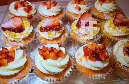 A dozen custom design cupcakes with a strawberries on top baked by pastry chef Lilac