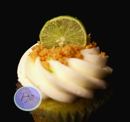 Close up of a custom cupcake with a lime on top by pastry chef Lilac